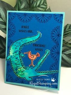 a card with an image of a crocodile on it and the words jungle wishes and crocodile kisses