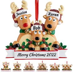 two reindeers with hats on their heads are hanging from a christmas ornament