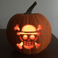 a carved pumpkin with a skull and crossbones on it