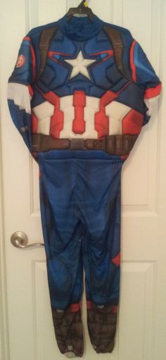 a child's captain america costume hanging on a door