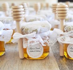 honey jars with labels on them sitting on a table