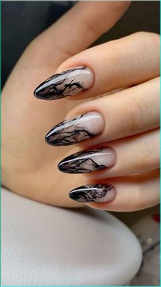 Elevate your nail game with this stunning black marble design, perfect for those who love a chic and edgy look. The intricate marbling effect creates a sophisticated contrast, making your nails stand out with a unique, artistic flair. 

Pair this look with Meta Nail Serum for enhanced nail strength and a glossy finish that lasts. 💅🖤 Black Design Nail Art, White To Black Ombre Nails, Corporate Goth Nails, Black And Silver Almond Nails, Black Smokey Nails, Neutral And Black Nails, Black Nails Marble, Edgy Almond Nails, Emo Nail Ideas