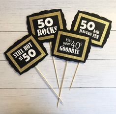 black and gold 50th birthday cupcake toppers with 50 rock's on them