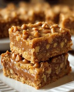 three pieces of peanut butter bars stacked on top of each other