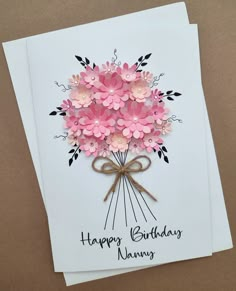 a birthday card with pink flowers on it