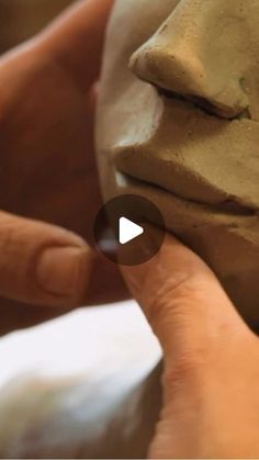 someone is making clay with their hands