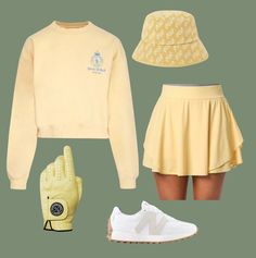 a woman's outfit including a tennis skirt, yellow hat and white adidas sneakers