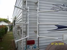 there is a ladder attached to the side of a trailer