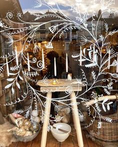 a display window with candles and other items in it