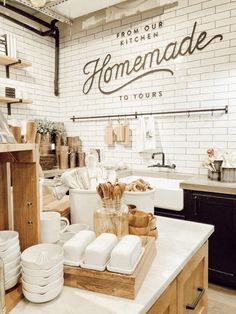 a kitchen filled with lots of white dishes