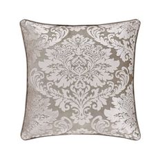 two decorative pillows with silver and white damasks on the front, one has a diamond