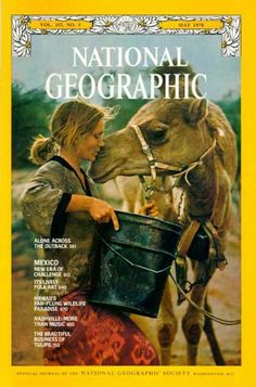 the cover of national geographic magazine with a woman feeding a donkey from a bucket