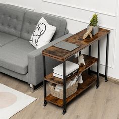 a living room with a gray couch and wooden table