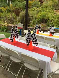 tables with checkered flags are set up for an event