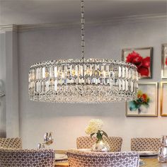 a chandelier hanging over a dining room table