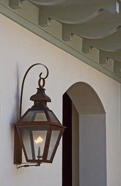 a light hanging from the side of a building