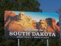 a sign for the welcome to south dakota, great faces and great places on it