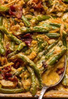 a casserole dish with green beans, bacon and other toppings on it