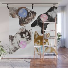 a wall mural with three dogs on it's side and one is blowing bubbles