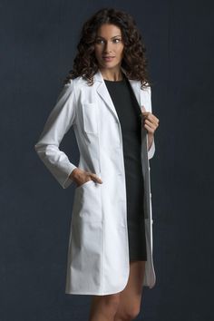 Constructed with 100% cotton fabric, this lab coat is crafted with a fashion notched collar and is tailored for the perfect fit and comfort for people of all sizes. It also includes two larger pockets and two smaller pockets on the chest for added convenience. Lab Coat Outfits Women, Lab Coat Outfit, Doctor Poses, Lab Coat Fashion, Doctor Clothes, Medical Clothes, Doctor White Coat, Women's Lab Coats, Men's Lab Coat