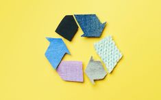 four different colored pieces of fabric on a yellow background