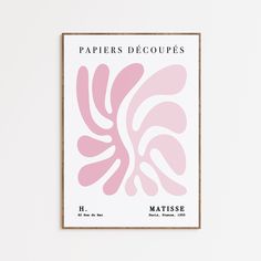 a pink poster with the words papers decoupes on it in front of a white wall