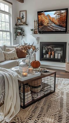 a living room filled with furniture and a flat screen tv mounted on the wall above a fire place