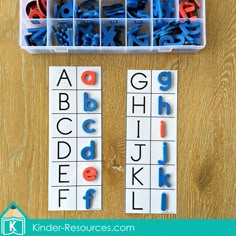 the letters and numbers are arranged in plastic trays to make letter recognition puzzles