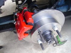 the brake assembly is being worked on by someone who has just finished their car's brakes