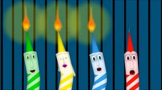 four different colored candles with faces on them