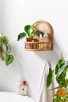 a bathroom with some plants on the wall