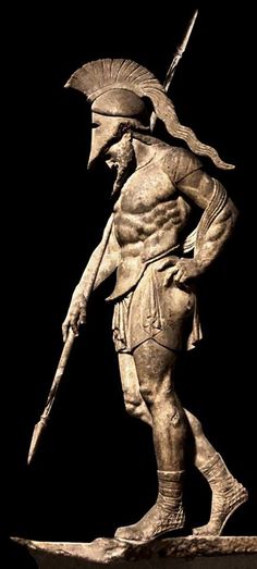 a statue of a man holding a spear