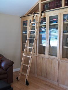 a ladder leaning up against a bookcase in a living room