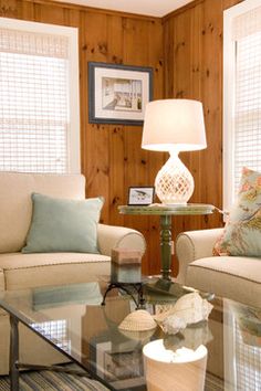 a living room with two chairs and a table