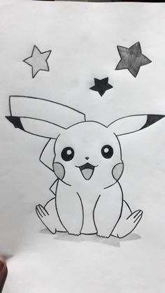 a drawing of a pikachu sitting in the middle of a piece of paper