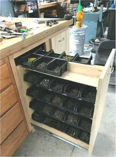 the drawers are filled with many different types of screws and nuts in their trays