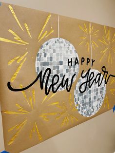 a happy new year's card hanging on a wall