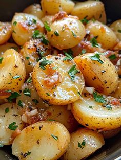 potatoes with parmesan cheese and herbs in a bowl