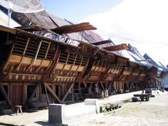 an old wooden building with many windows and balconies