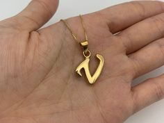 Gold Letter V Pendant made of Gold Vermeil: 18k Gold over Solid 925 Sterling Silver ☞ made to last.Matching Ring & Matching Earrings - please ask meDetails:• Gold Letter V Pendant• Dimensions: Pendant Height 24mm, Width 16mm• Free Complimentary Chain• 18k Gold VermeilSKU TE-107 Name Locket, Photo Splash, V Pendant, V Necklace, Girl Iphone Wallpaper, Ring Matching, Gold Chain Design, Gold Letter, Matching Ring