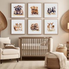 a baby's room with four pictures on the wall