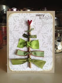 a christmas card with a tree made out of ribbon