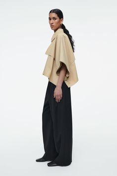 CROPPED TRENCH COAT CAPE - LIGHT BEIGE - COS Trench Coat Beige, Coat Cape, Nyfw Runway, Cropped Trench Coat, Genetically Modified, Cape Coat, Pesticides, Trench Coats, Trousers Women