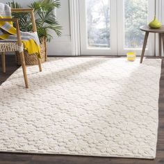 a large white rug in a living room