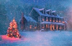 a lit christmas tree in front of a house with snow falling on the ground and trees