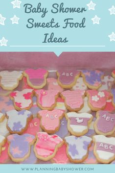 baby shower sweet food ideas with pink, purple and blue decorated cookies in a box