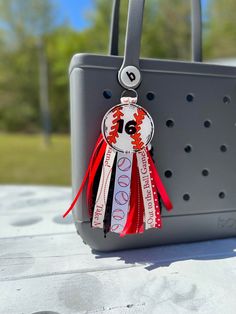 a handbag is decorated with ribbons and numbers