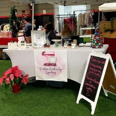 a table that has some items on it and is set up in front of a tent