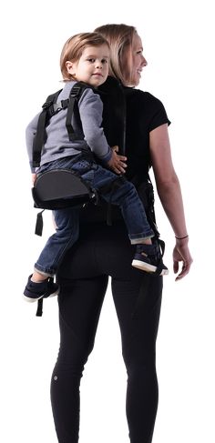 a woman carrying a child in her back pack