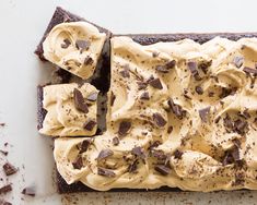 an overhead view of a chocolate cake with cream frosting